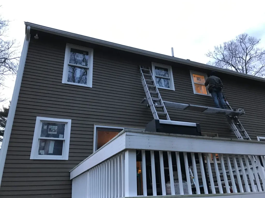 Modern home featuring newly installed Andersen windows by MR. ROOF. INC