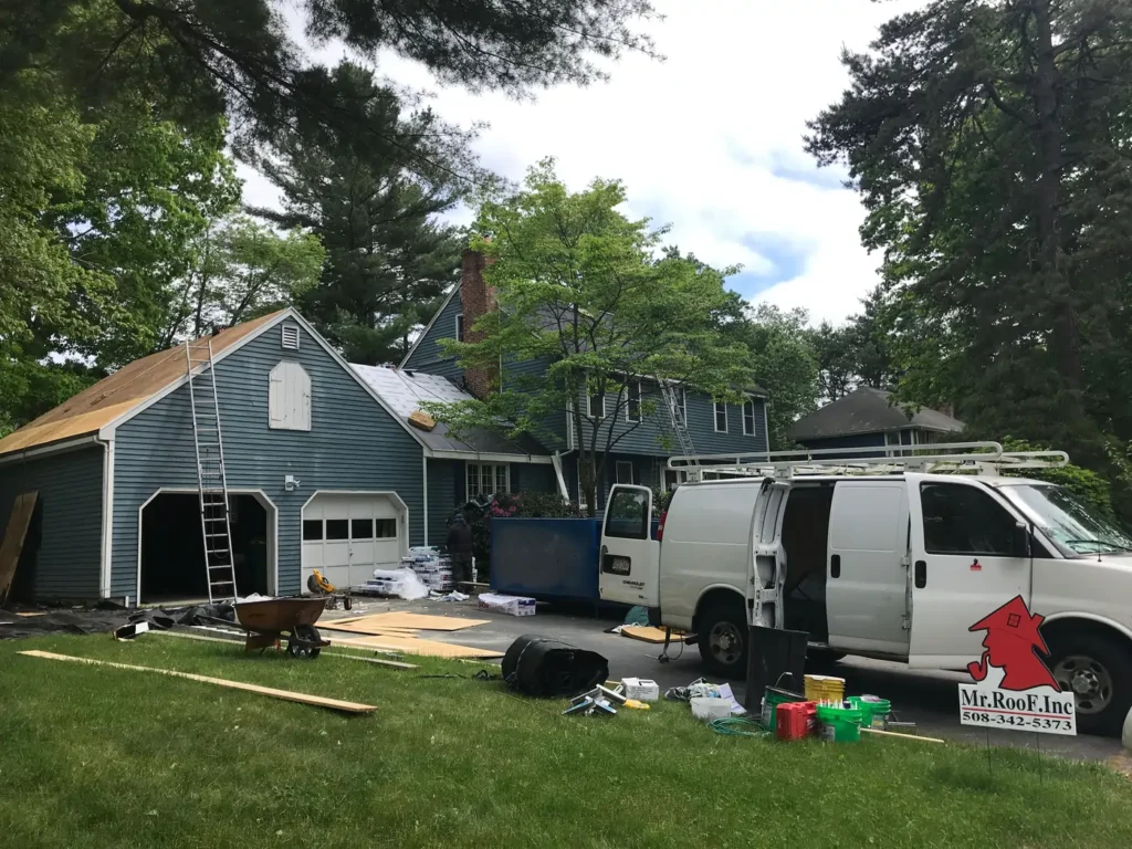 Mr. Roof, Inc professionals replacing an old roof with new shingles