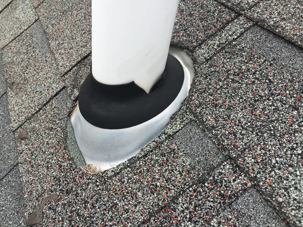 New pipe boot flashing installed to seal a roof penetration