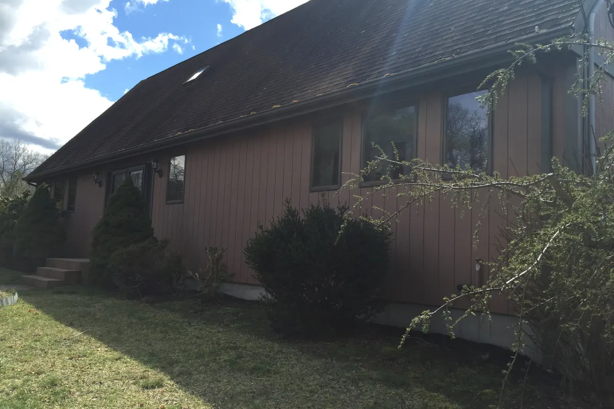 Rehoboth home exterior before siding and roof improvements