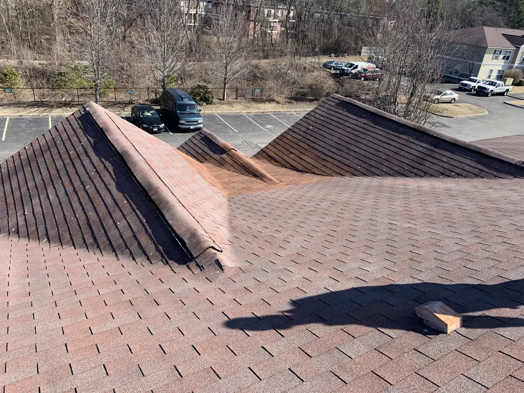 Asphalt shingle roof area after localized repair work