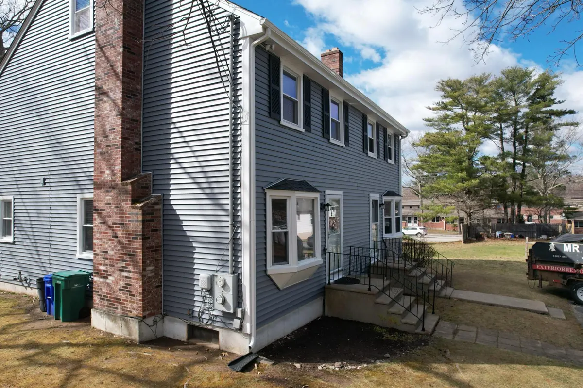 Completed siding and asphalt shingle roof replacement on a Massachusetts home